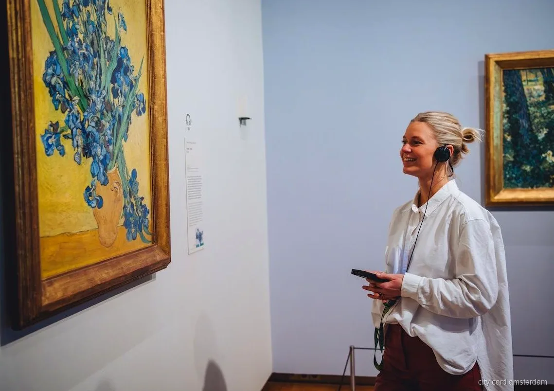 Visitors viewing Van Gogh paintings with timed entry tickets